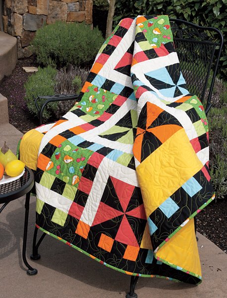 "Whirlwind" is a Free Lap Quilt Pattern designed by Mari Martin from Connecting Threads!